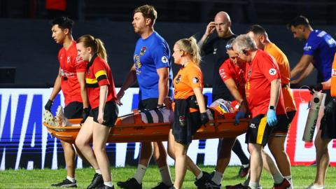 Bradford Bulls forward Will Gardiner is stretchered from the field by medical teams