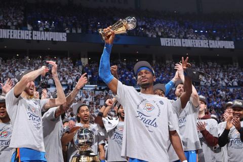 Shai Gilgeous-Alexander holding the 2024-25 NBA's Most Valuable Player award