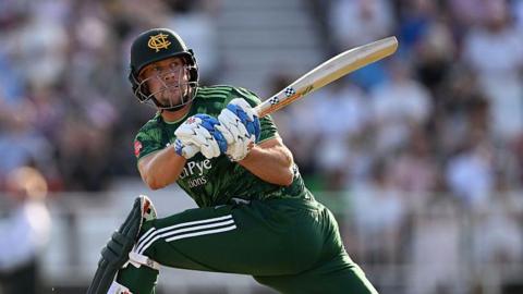 George Munsey, in action for Notts Outlaws, reverse sweeping the ball during the 2026 campaign.