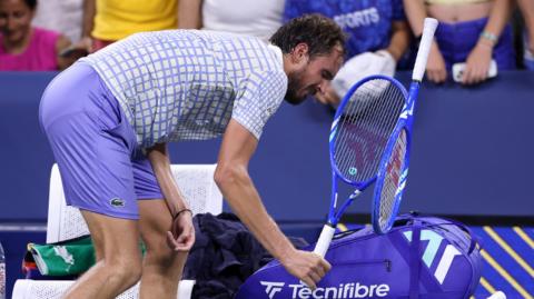 Daniil Medvedev smashes his racquet after the 2025 US Open defeat by Benjamin Bonzi