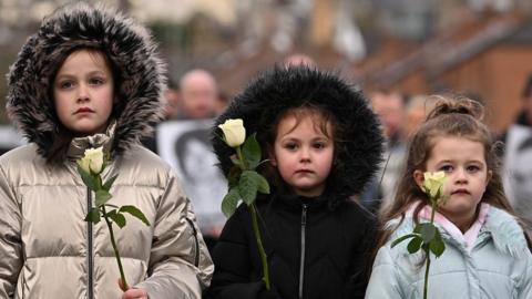 Three young girls at the Bloody Sunday ceremony