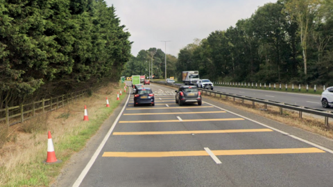 Cars heading towards and away from Brundall roundabout