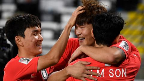 Kim Minjae celebrates with Hwang In-Beom and Son Heung-min after scoring a goal for South Korea