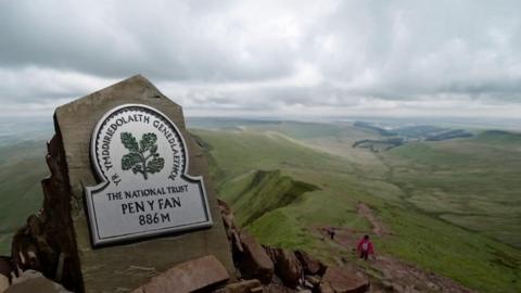 About 350,000 people climb to the summit each year