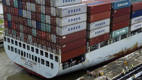 The cargo ship Cosco Houston crosses the new Cocoli Locks during a test at the Panama Canal on June 23, 2016.