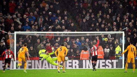 Sheffield United's Oliver Norwood scores a penalty against Wolves