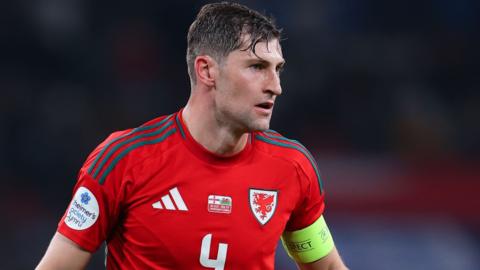 Ben Davies wearing the Wales captain's armband