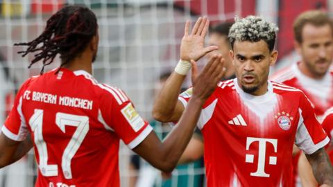 Luis Diaz and Michael Olise celebrate after Diaz scores for Bayern Munich