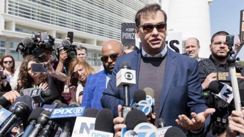 Republican Congressman George Santos of New York talks with reporters after exiting a federal court house where he appeared before a judge following his indictment today in Central Islip, New York, USA, 10 May 2023