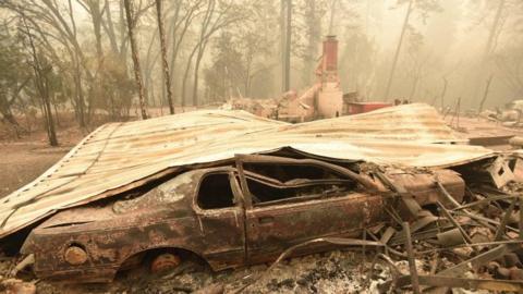 A burnt-out car in Paradise