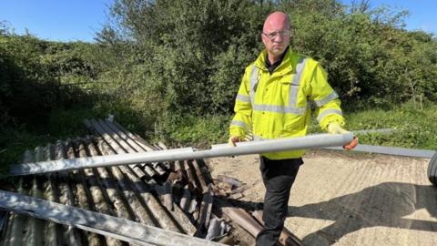 Ben Wilkin, enforcement officer at a fly-tip site at Caxton Gibbet