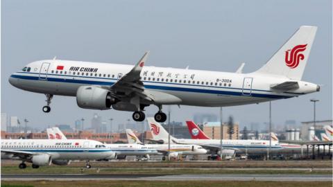 An Air China plane flies at the Chengdu Shuangliu International Airport.