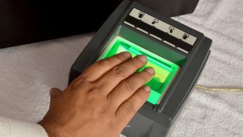 Fingers on a fingerprint reader