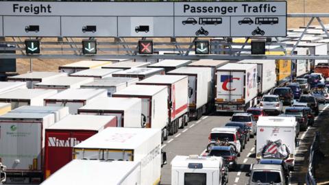 Vehicles queue to enter the Eurotunnel terminal in Folkestone