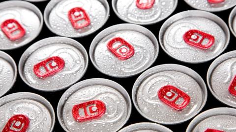 Tops of cans of energy drinks.