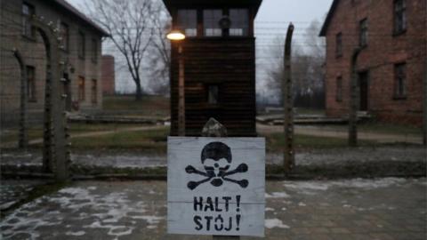 A sign reading "Stop!" in German and Polish is seen at the former Nazi German concentration and extermination camp Auschwitz, 27 January 2018