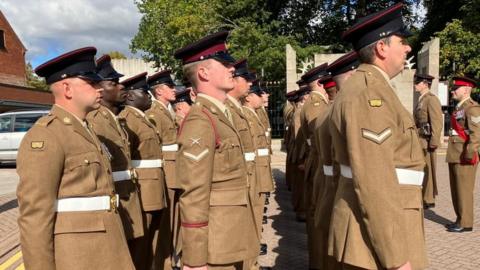 soldiers on parade in a street