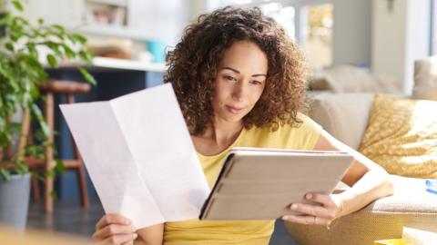 Woman looking at laptop