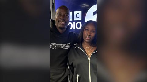 Eddie Kadi and Tolani stand in the Radio 1Xtra studio