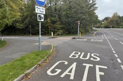 A road with BUS GATE on the tarmac.