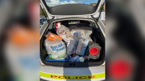 Groceries, including bread, in the boot of a Lincolnshire Police vehicle  