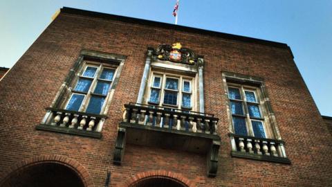 A photo of Dudley Council House showing windows and a flag on the roof