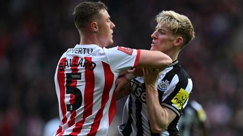 Anthony Gordon (R) clashes with Sunderland's English midfielder #05 Daniel Ballard (L) during the English FA Cup third round football match between Sunderland and Newcastle United at The Stadium of Light in Sunderland on January 6, 2024.