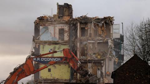 A block of flats on Freshwater Road in Dagenham is demolished. 