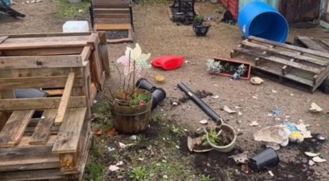 Rubbish and debris left at the site of a community garden