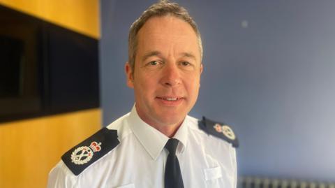 Chief Constable Paul Gibson wearing shirt with shoulder straps denoting his rank 