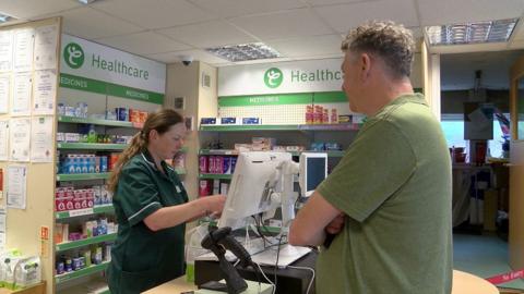 Generic picture of a pharmacist and customer