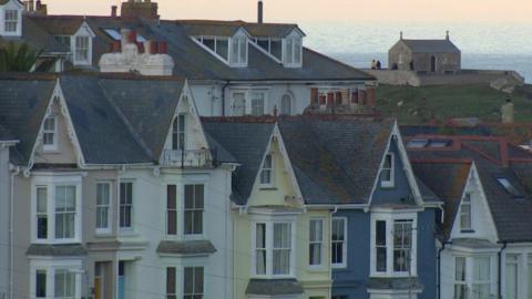 Rows of properties with sea in distance