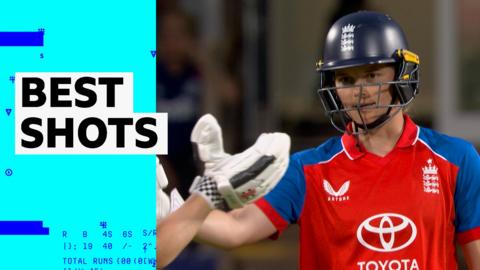 Amy Jones goes to high-five team-mate