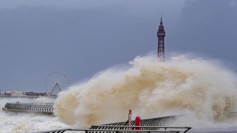 Waves crash over the Blackpool tower