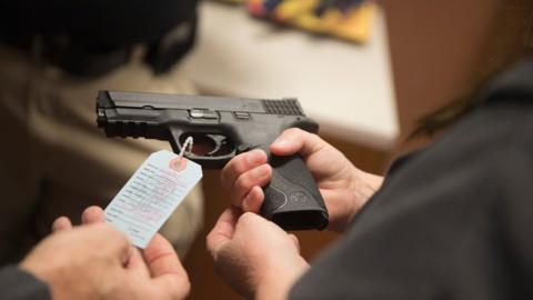 Customers shop for a handgun at Metro Shooting Supplies on November 12, 2014 in Bridgeton, Missouri.