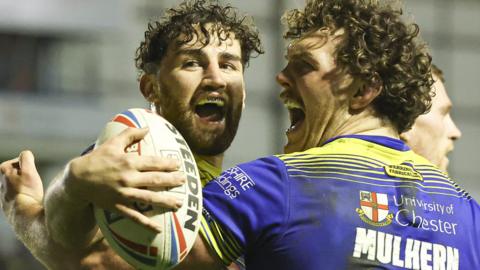 Warrington celebrate a try