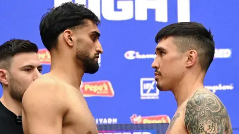Adam Azim and Steve Claggett face off