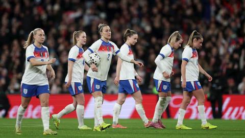 The Lionesses disburse from a huddle