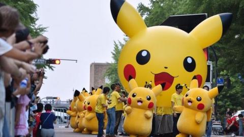 Costumed performers as Pikachu, the Pokemon series character