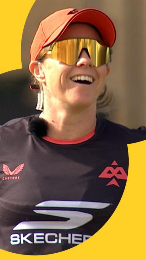 Tammy Beaumont laughs while talking into her microphone