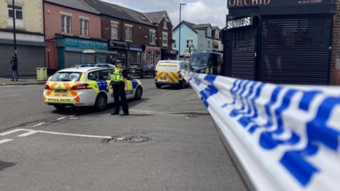 Police tape at the edge of a cordon