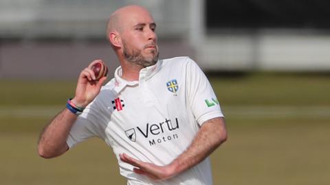 Chris Rushworth bowling for Durham