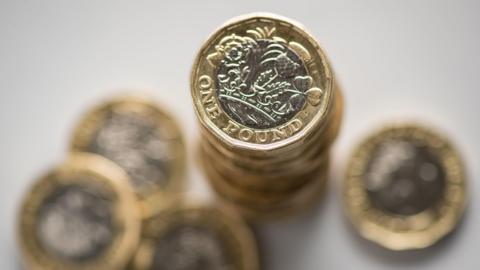 A stack of pound coins.