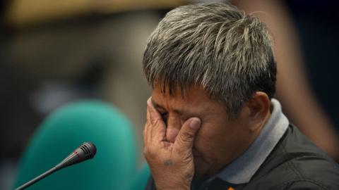 Former death squad member Edgar Matobato gestures as he testifies during a senate hearing in Manila, 15 September 2016