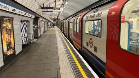 Tube train on Stockwell station platform