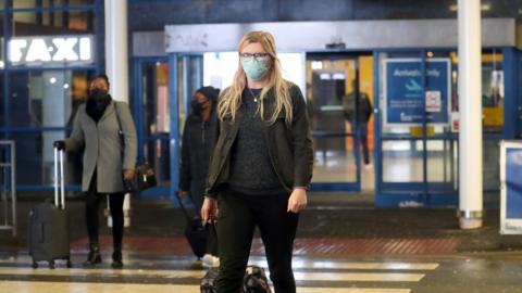 Woman arrives at Belfast International Airport