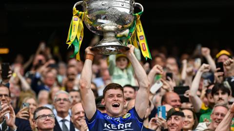 Gavin White lifts the cup