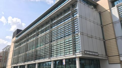 A glass building with Nottingham City Council branding on the side