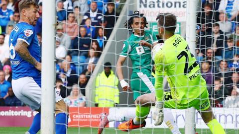 Chesterfield goalkeeper Ryan Boot can not keep Jayden Luker's shot from crossing the line for Notts County