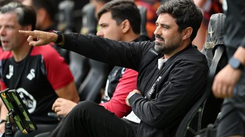 Vitor Matos pointing in the dugout 